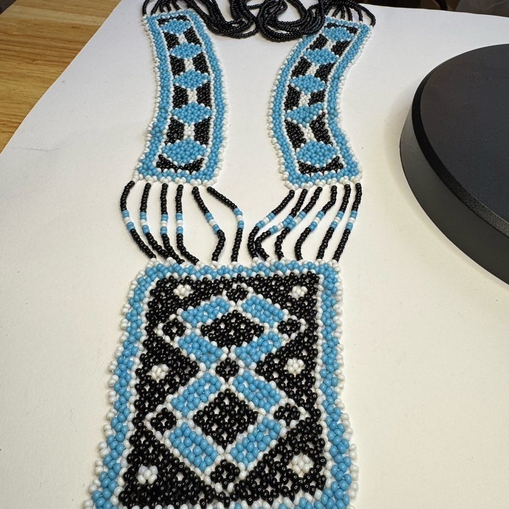 Gorgeous beaded necklace in blue, black, and white